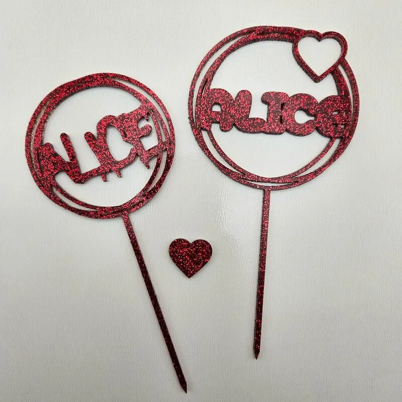 Cake topper with 'ALICE' text